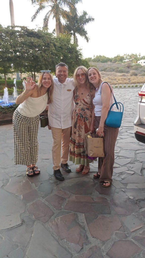 Private Cabo airport shuttle chauffeur greeting guests at SJD Airport