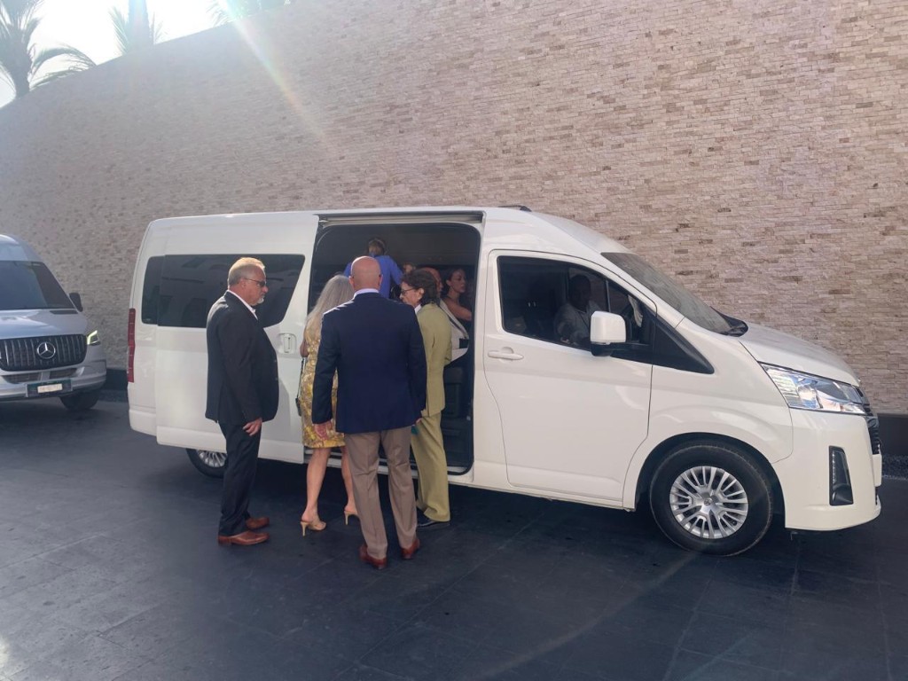 Wedding party laughing on a Mercedes-Benz Sprinter for Cabo San Lucas group transportation